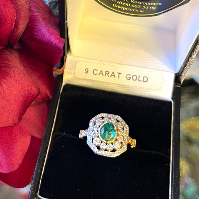 Emerald and diamond gold ring